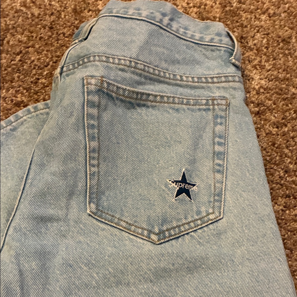 Supreme Light Blue Denim Jeans with Star Detail